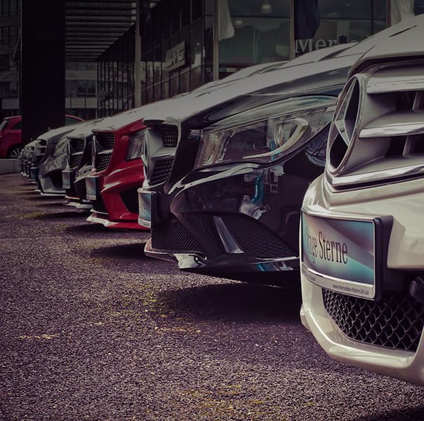 Cars lined up next to each other.